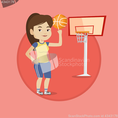 Image of Young basketball player spinning ball.