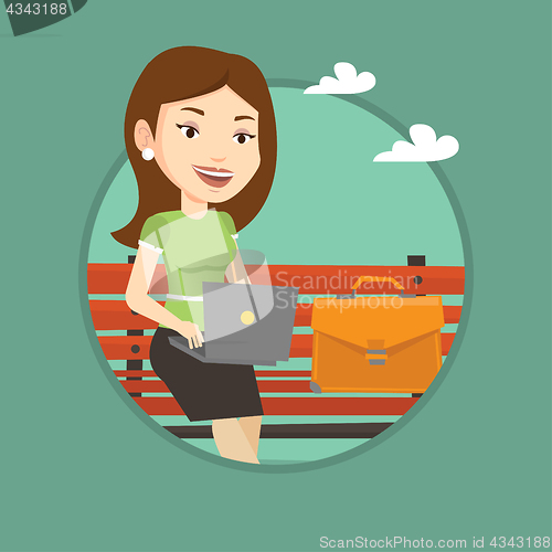 Image of Business woman working on laptop outdoor.