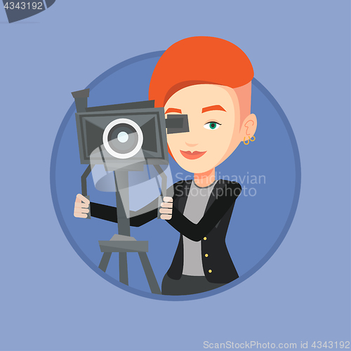 Image of Cameraman with movie camera on tripod.