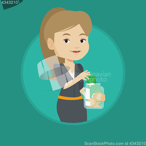 Image of Woman putting dollar money into glass jar.