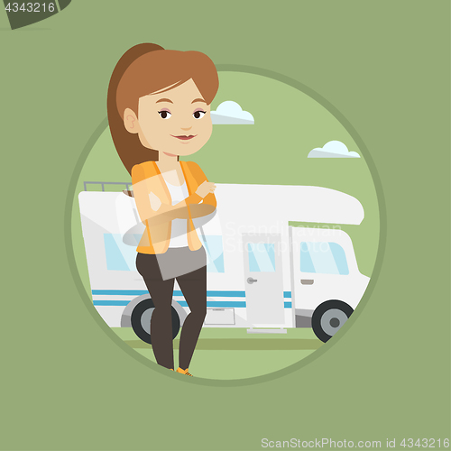 Image of Woman standing in front of motor home.