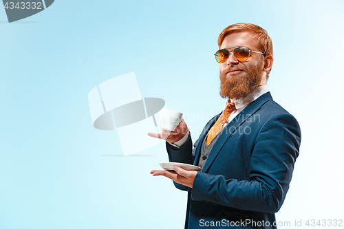 Image of Portrait of a business man isolated on blue background.