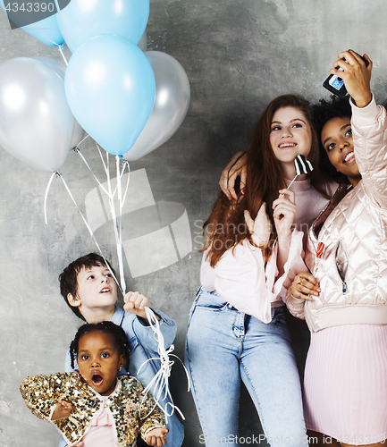 Image of Lifestyle and people concept: young pretty diversity nations woman with different age children celebrating on birth day party together happy smiling, making selfie. African-american, asian and caucasi