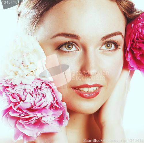 Image of young beauty woman with flower peony pink closeup makeup soft te