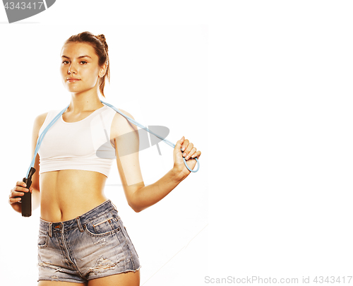 Image of young pretty woman with skipping rope isolated on white