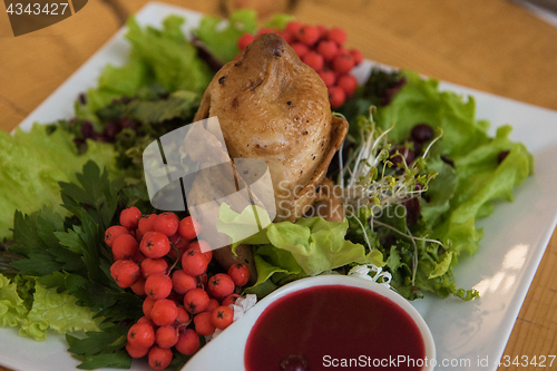 Image of quail roasted with sweet and sour cranberry sauce