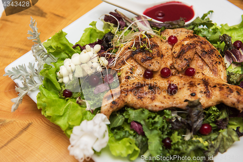 Image of quail roasted with sweet and sour cranberry sauce