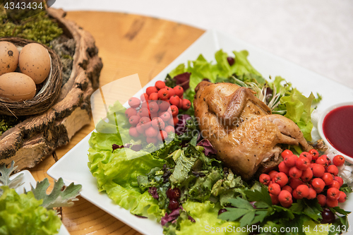 Image of quail roasted with sweet and sour cranberry sauce