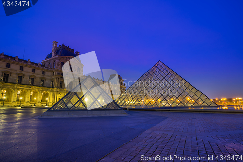 Image of View of famous Louvre Museum with Louvre Pyramid