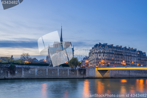 Image of Notre Dame Cathedral with Paris cityscape at dus