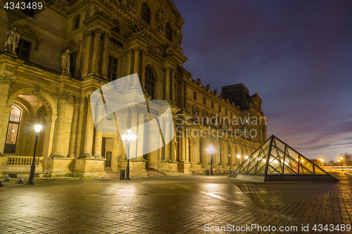 Image of View of famous Louvre Museum with Louvre Pyramid