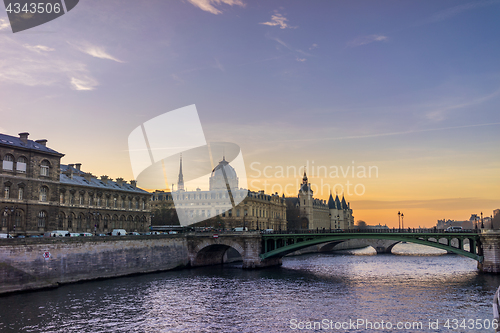 Image of Bridge by the Seine river in Paris at night