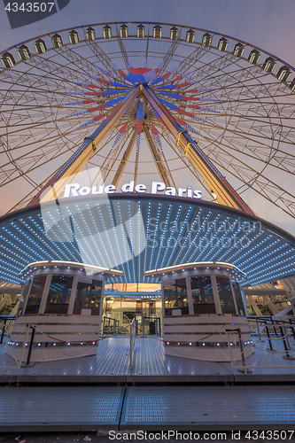 Image of Place de la Concorde at sunset. Ferris wheel and Egyptian obelis