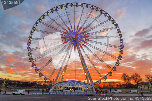 Image of Place de la Concorde at sunset. Ferris wheel and Egyptian obelis