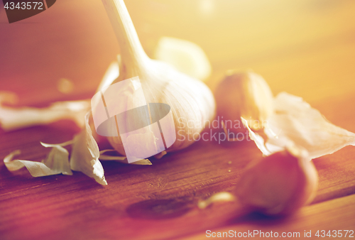 Image of close up of garlic on wooden table