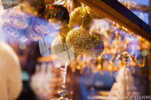 Image of close up of christmas decorations at shop window