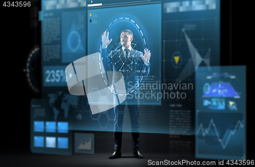 Image of businessman in suit with virtual projection