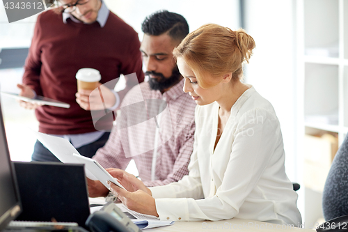 Image of business team with tablet pc in office