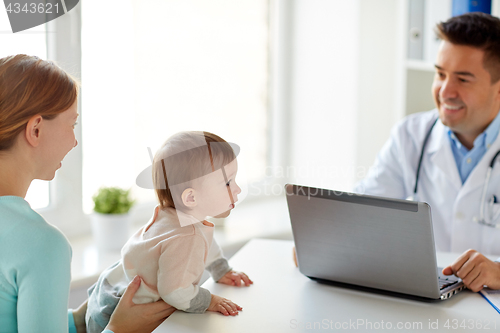 Image of woman with baby and doctor with laptop at clinic