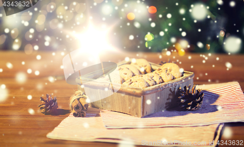 Image of close up of christmas oat cookies on wooden table