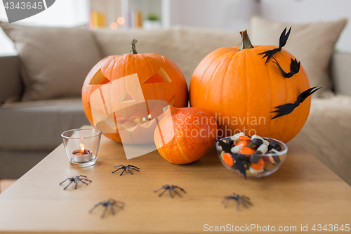 Image of jack-o-lantern and halloween decorations at home