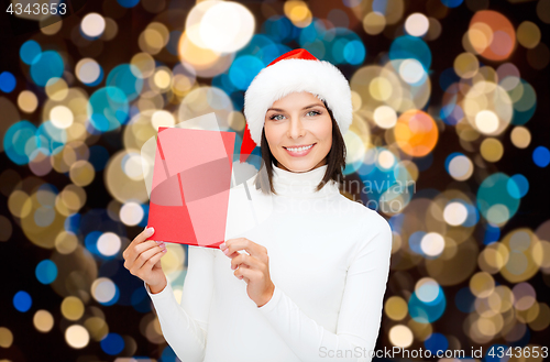 Image of happy woman with christmas greeting card
