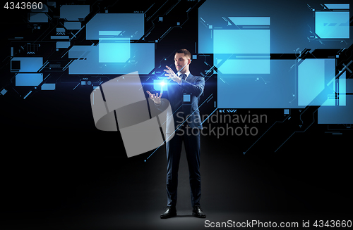 Image of businessman working with virtual screen