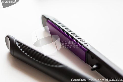 Image of close up of flat hair straightening iron