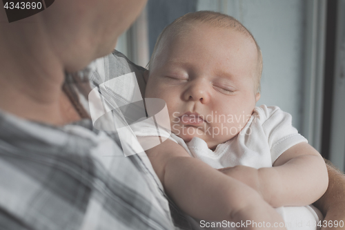 Image of Father Holding Newborn Baby Son