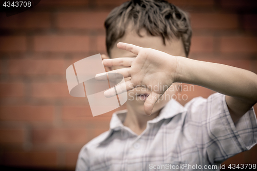 Image of Portrait of a sad little boy.