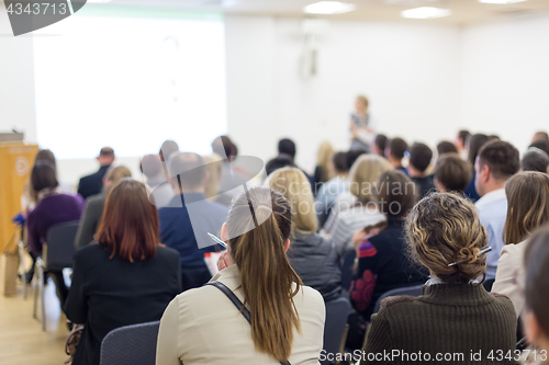 Image of Woman giving presentation on business conference.