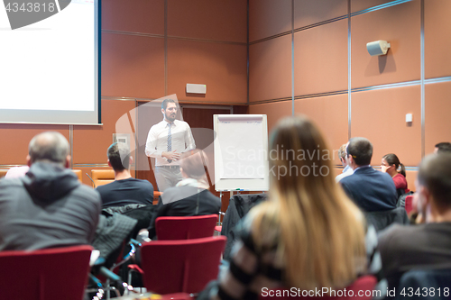 Image of Speaker Giving a Talk at Business Meeting.