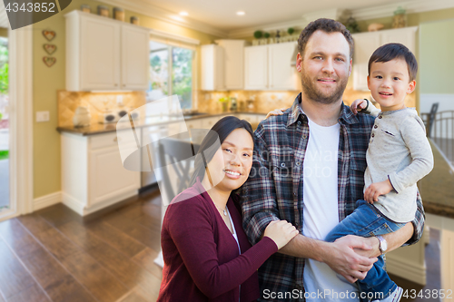 Image of Mixed Race Chinese and Caucasian Parents and Child Indoors Insid