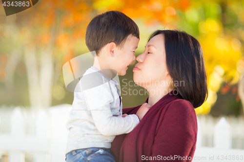 Image of Chinese Mother Having Fun with Her Mixed Race Baby Son