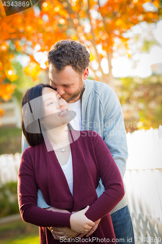 Image of Outdoor Fall Portrait of Chinese and Caucasian Young Adult Coupl