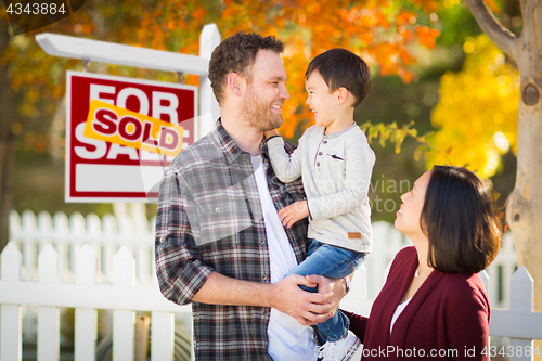 Image of Mixed Race Chinese and Caucasian Parents and Child In Front of F