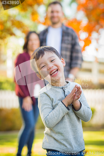 Image of Outdoor Portrait of Happy Mixed Race Chinese and Caucasian Paren