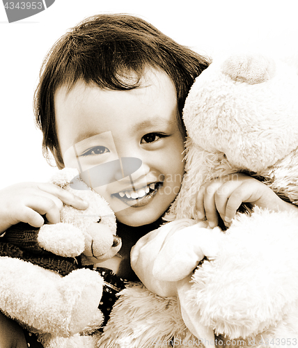 Image of Cute Young Girl Hugging Two Teddy Bears