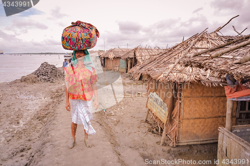 Image of Man with heavy load in Bangladesh