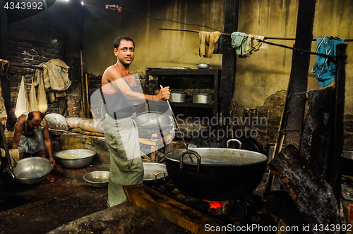 Image of Man with ladle in Bangladesh