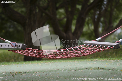 Image of empty cable hammock in a park