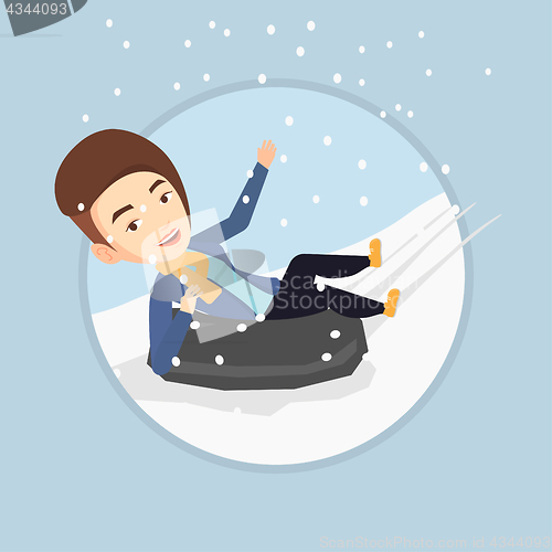 Image of Woman sledding on snow rubber tube in mountains.