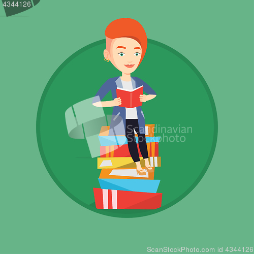 Image of Student sitting on huge pile of books.