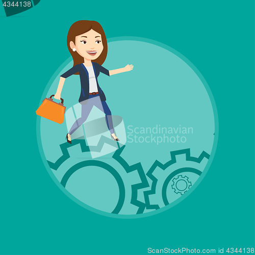 Image of Business woman running on cogwheels.