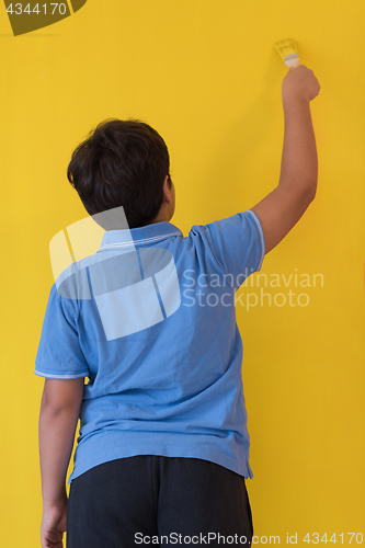 Image of Portrait of a happy young boy painter