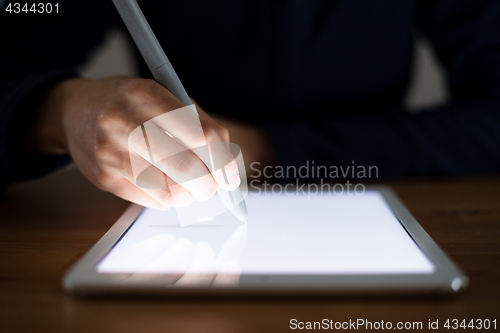 Image of Woman using pen drawing on tablet pc