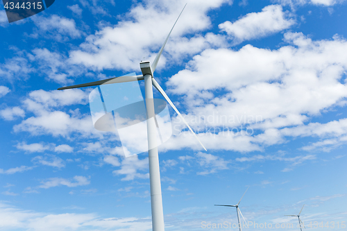 Image of Wind turbine with blue sky