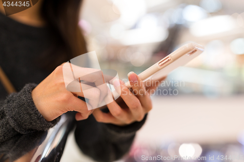 Image of Woman wokring on mobile phone