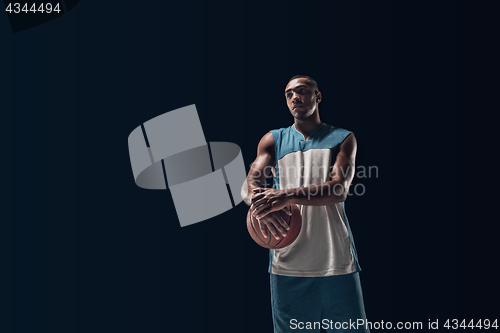 Image of The portrait of a basketball player with ball