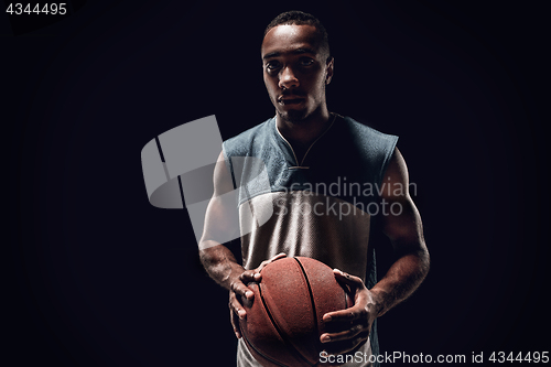 Image of The portrait of a basketball player with ball